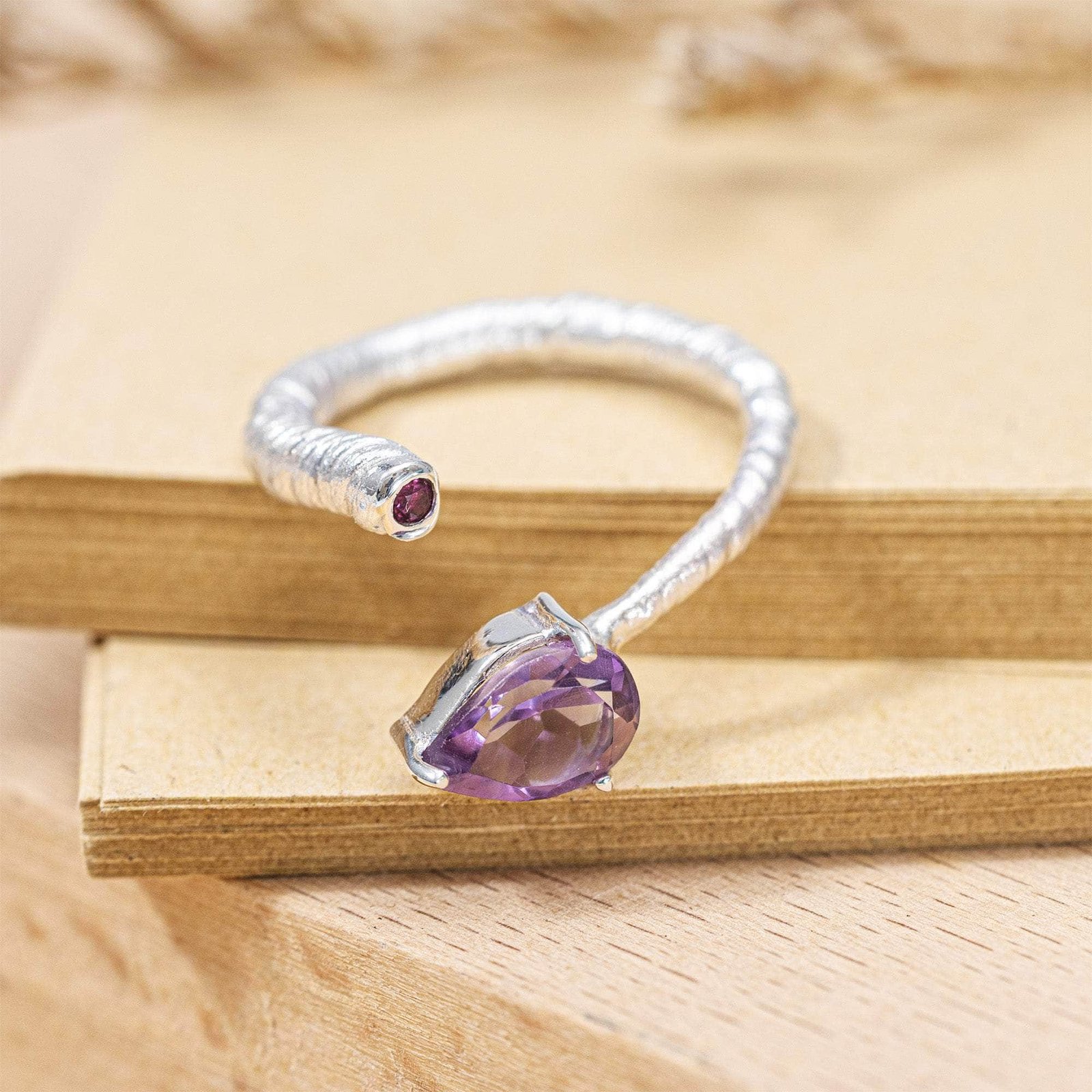 korra open band ring in silver with pear and round cut amethyst and anti tarnish coating korra open band ring in silver with pear and round cut amethyst and anti tarnish coating